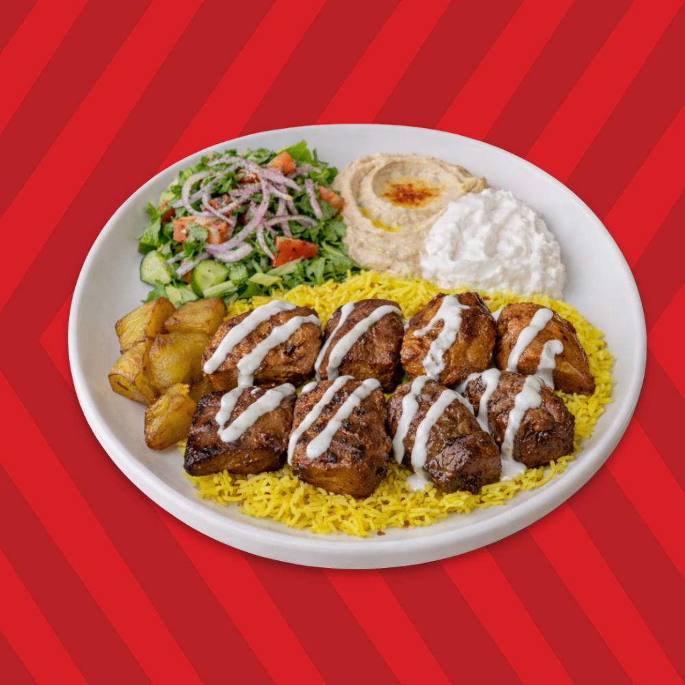 Beef kebab plate with rice, salad and garlic sauce